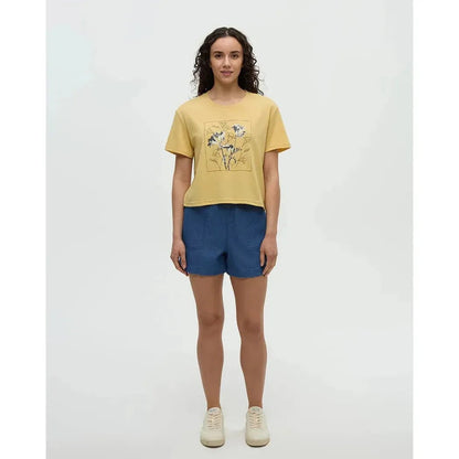 A model wearing the Tentree Women's Floral Crop T-Shirt in Dusk Yellow Meteorite Black stands against a plain white background.