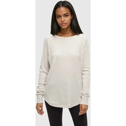 A front view of the Tentree Women's Storey Longsleeve in Vintage White Heather on a model wearing black pants against a light gray background.