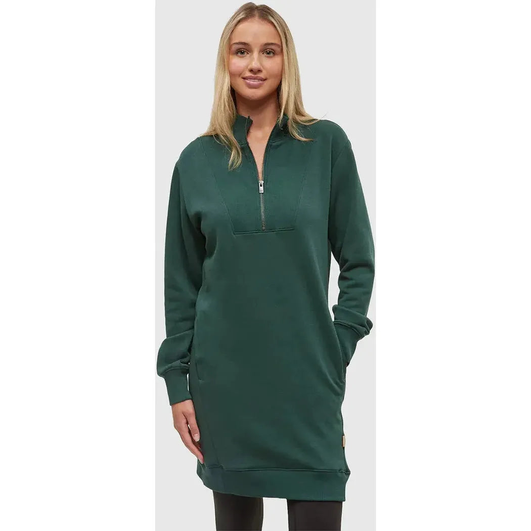 A model wears the Tentree Women's Weston Dress in Forest Pine, a long-sleeved dress with a half-zip neck, against a plain white background.