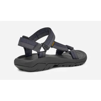 Side view of the Teva Men's Hurricane XLT2 Sandal in Archive Ladder Navy showing the adjustable straps and rugged outsole against a white background.
