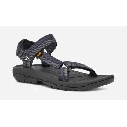 Side view of the Teva Men's Hurricane XLT2 Sandal in Archive Ladder Navy with a black outsole and adjustable straps against a white background.