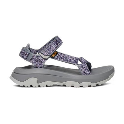 Side view of the Teva Women's Hurricane XLT3 in Criss Cross Bossa Nova showing the adjustable straps and thick outsole against a white background.