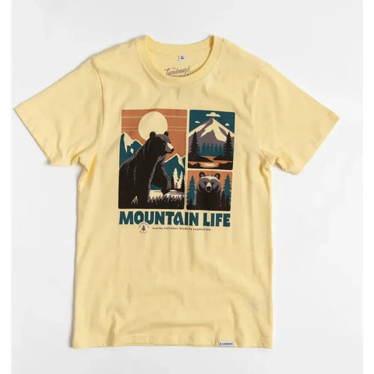 A front view of the yellow The Landmark Project Mountain Life Unisex Short Sleeve Tee showing the bear graphic and mountain design on a white background.