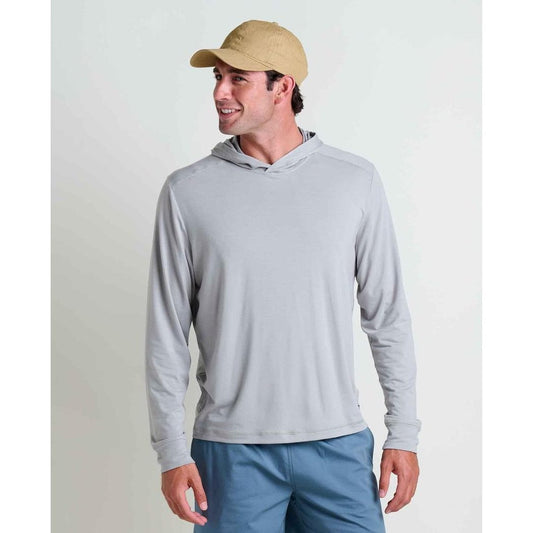 A man wearing the Toad & Co Men's Swifty Long Hoodie in Light Ash stands against a plain white background.