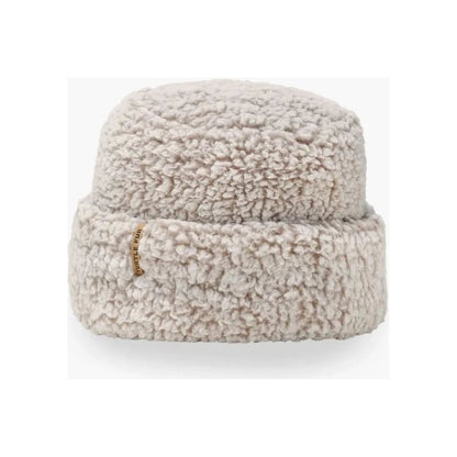 A front view of the Turtle Fur Comfort Lush Après Tort hat in Black with a small gold tag on the brim against a white background.