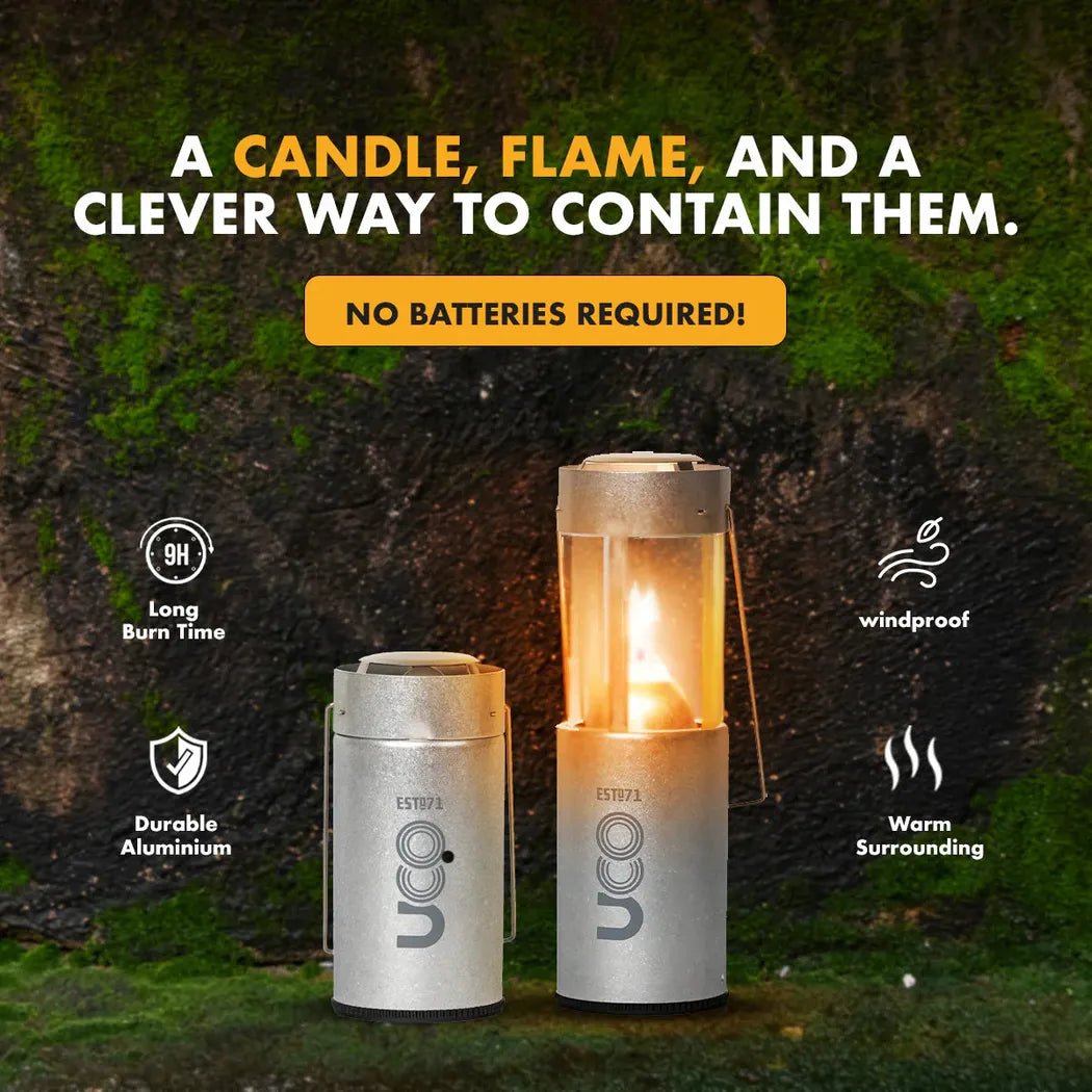 Two UCO Original Candle Lanterns in Aluminum sit on mossy ground with a dark, mossy background, showing their windproof and warm surrounding features.