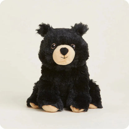 A front view of the Warmies Black Bear Junior plush toy with a light background.