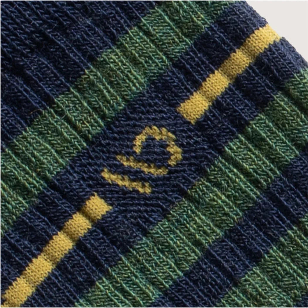 A close-up of the Wide Open Men's Vintage Stripe Midweight Crew Sock in Denim showing the vintage stripe pattern and yellow stripe detail.
