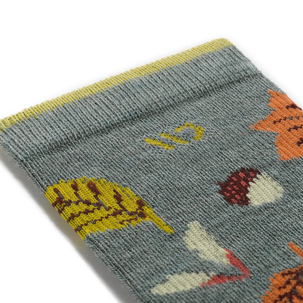 Close-up of the Wide Open Women's Fall In Love Cushioned Crew Socks in Seafoam showing the leaf and acorn pattern on the fabric.