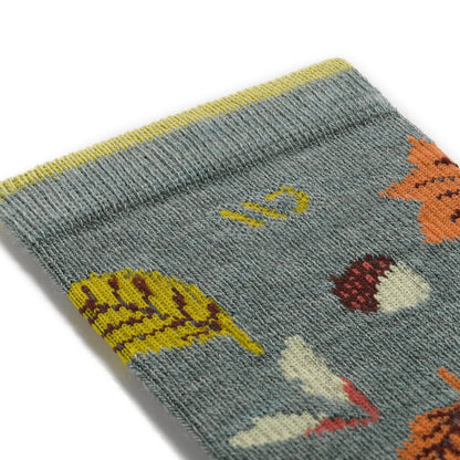 Close-up of the Wide Open Women's Fall In Love Cushioned Crew Socks in Seafoam showing the leaf and acorn pattern on the fabric.