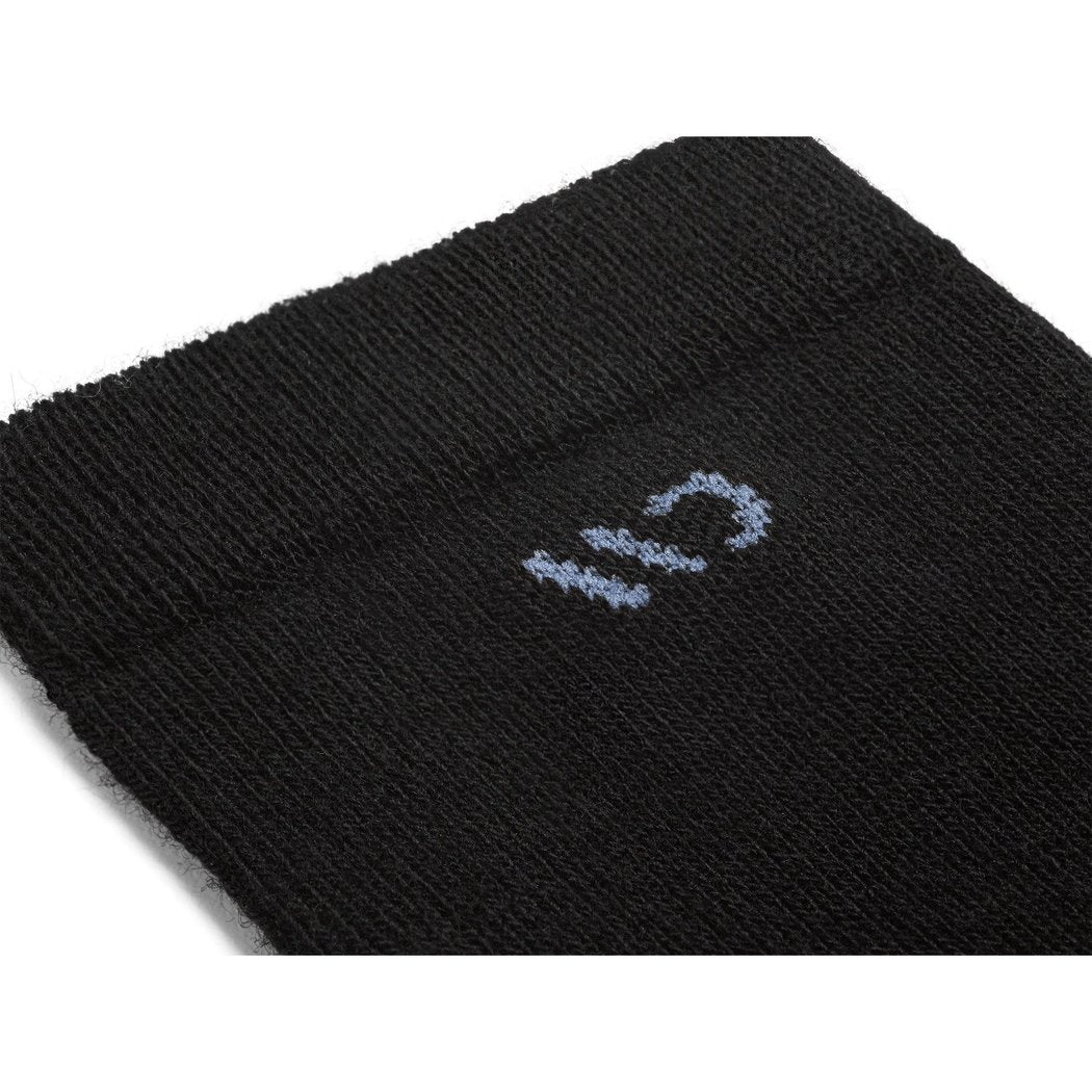 Close-up of the Wide Open Women's Solid Cushioned Crew Socks in Black showing the light blue logo on the black fabric.