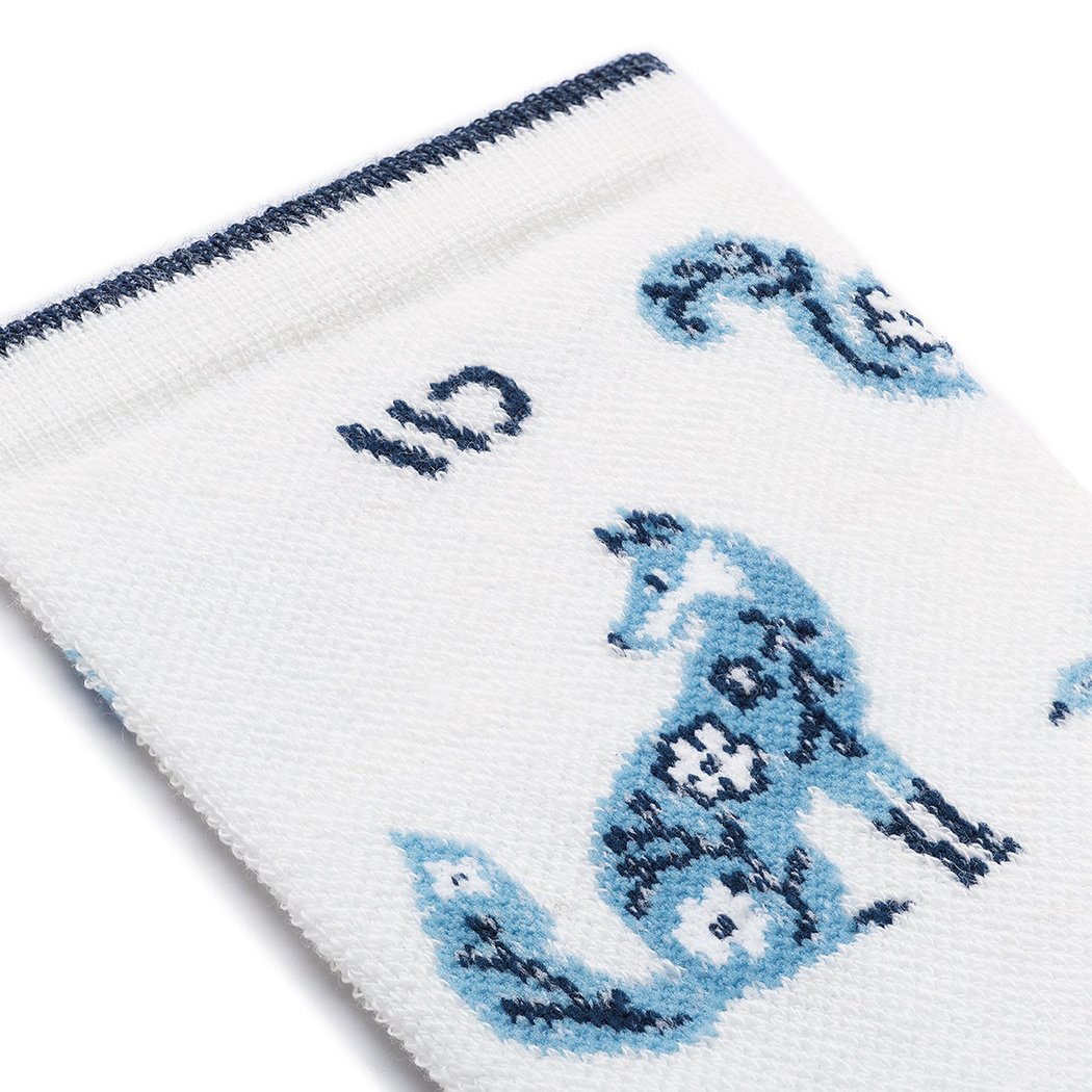 Close-up of the Wide Open Women's Woodland Wonder No Cushion Micro Crew Socks in Teal showing a fox design on a white background.